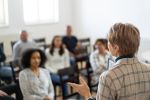 A therapist leading a support group for multiracial people needing help and advise